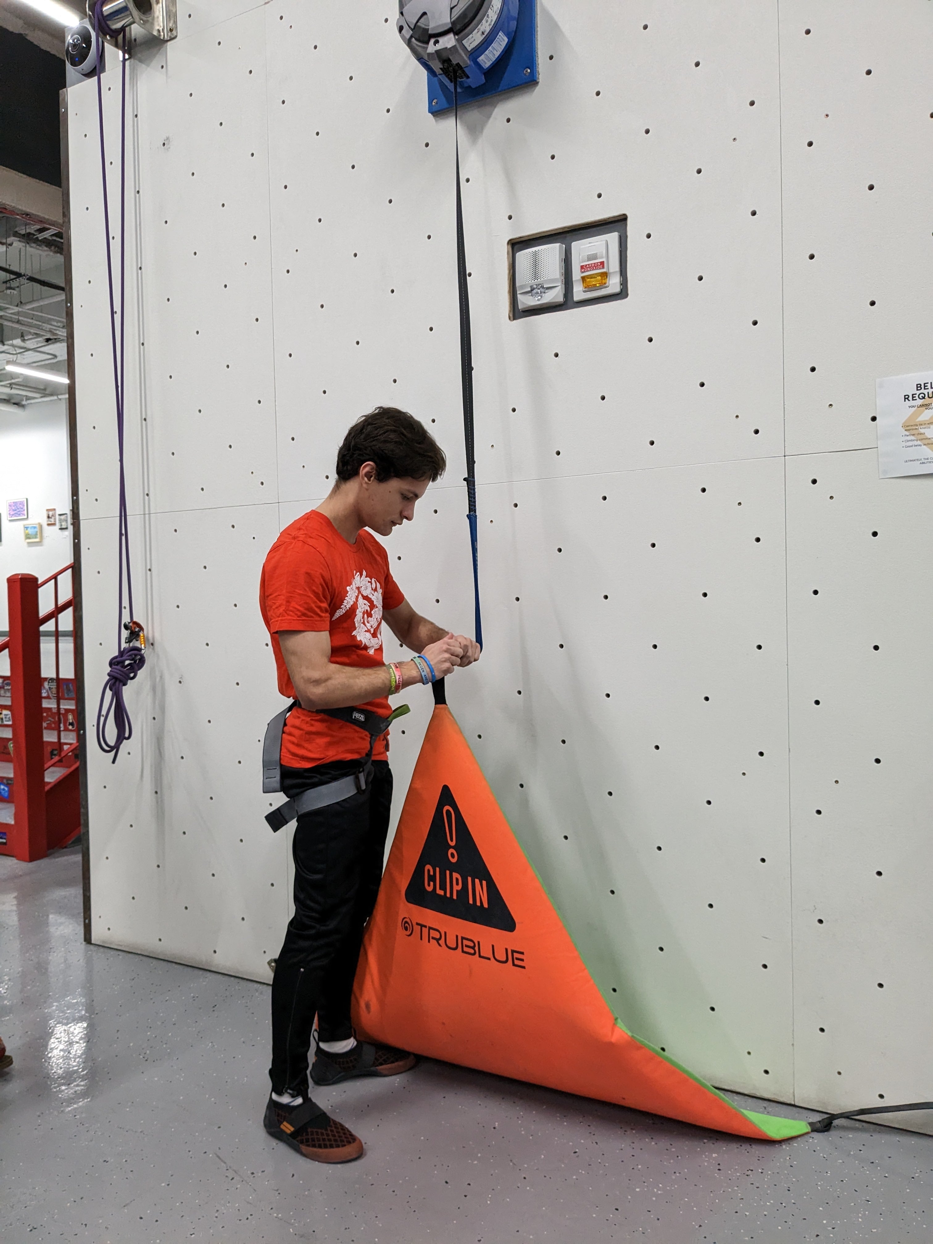 PhD students taking trainings for the rock climbing